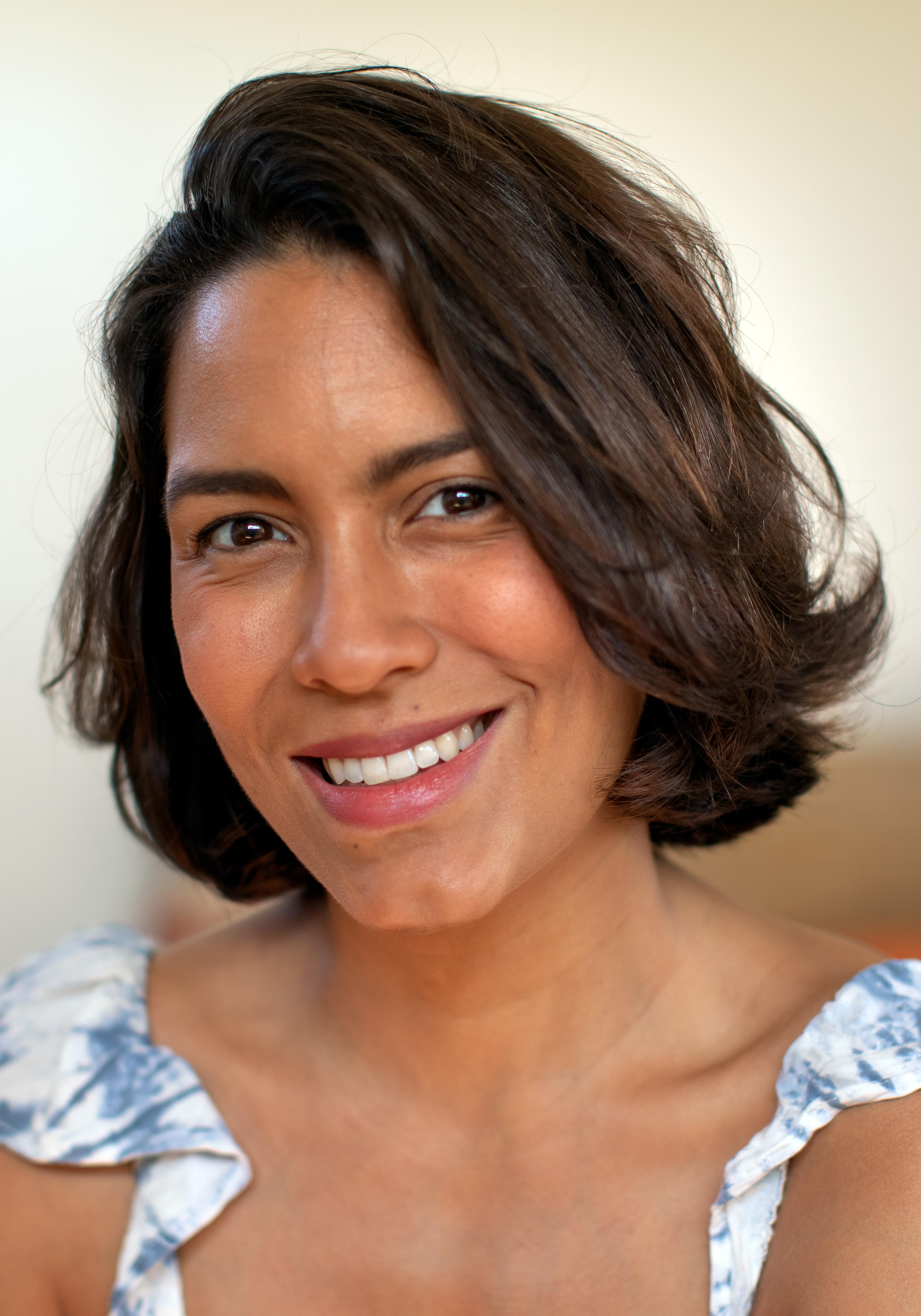 Tatiana Fernandez Geara looks directly at the camera and smiles.