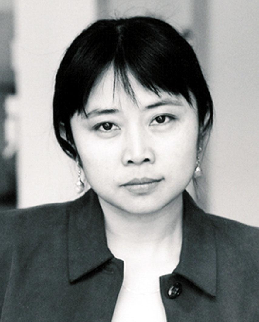 A black and white photo of a woman making a serious expression into the camera.
